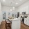 Open concept home with large kitchen and hardwood style flooring